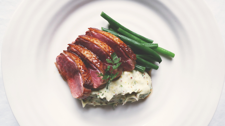 Roast duck breast with green beans and grain mustard mashed potato
